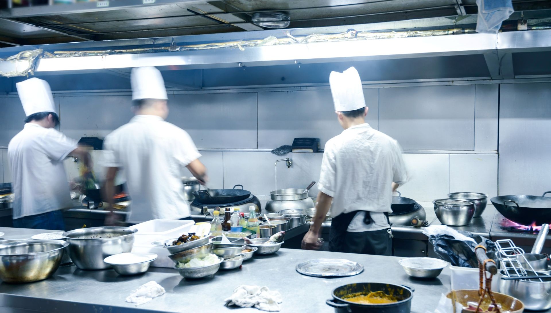 motion chefs of a restaurant commercial kitchen