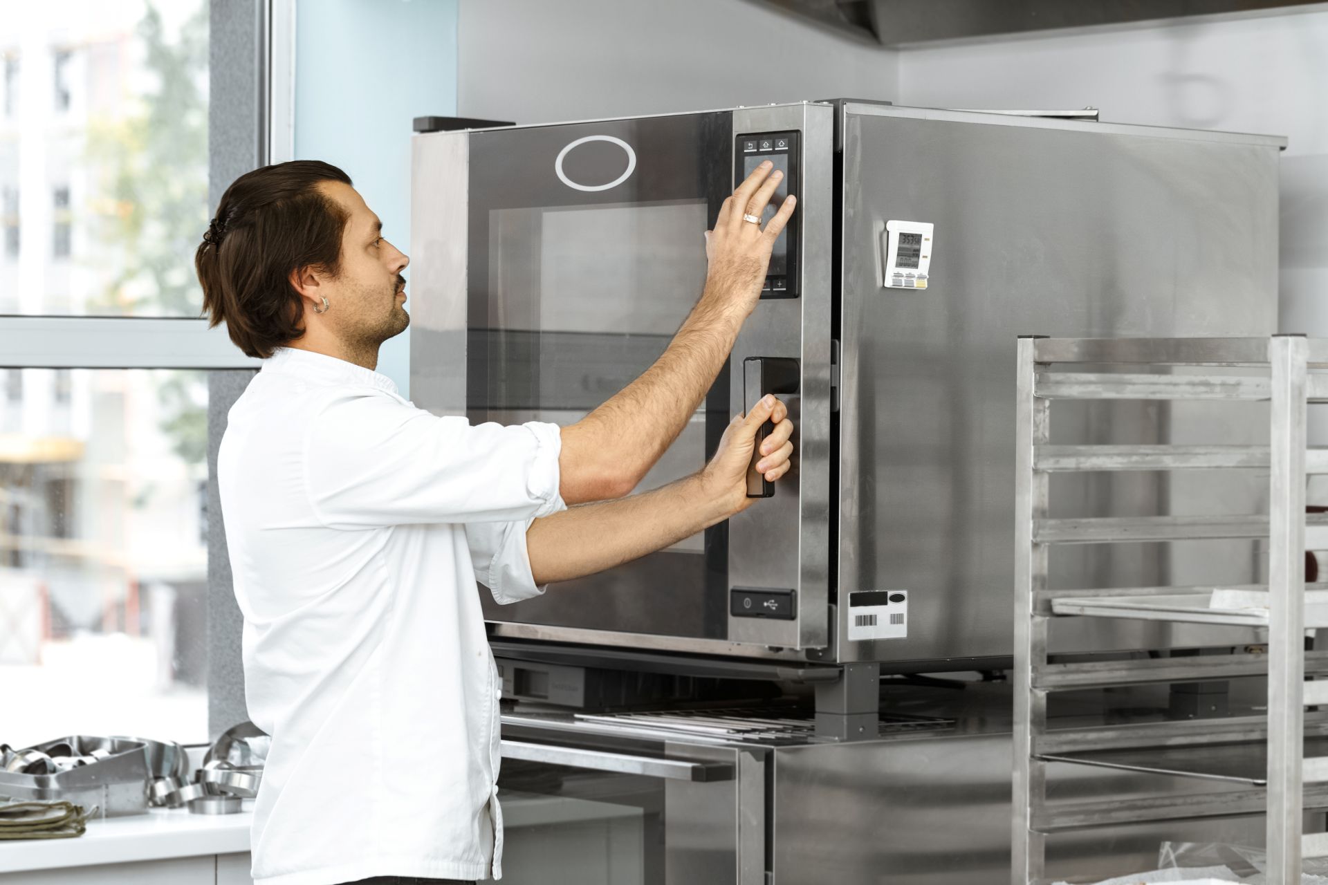 Baker working with Combi Oven Baker working with Combi Oven